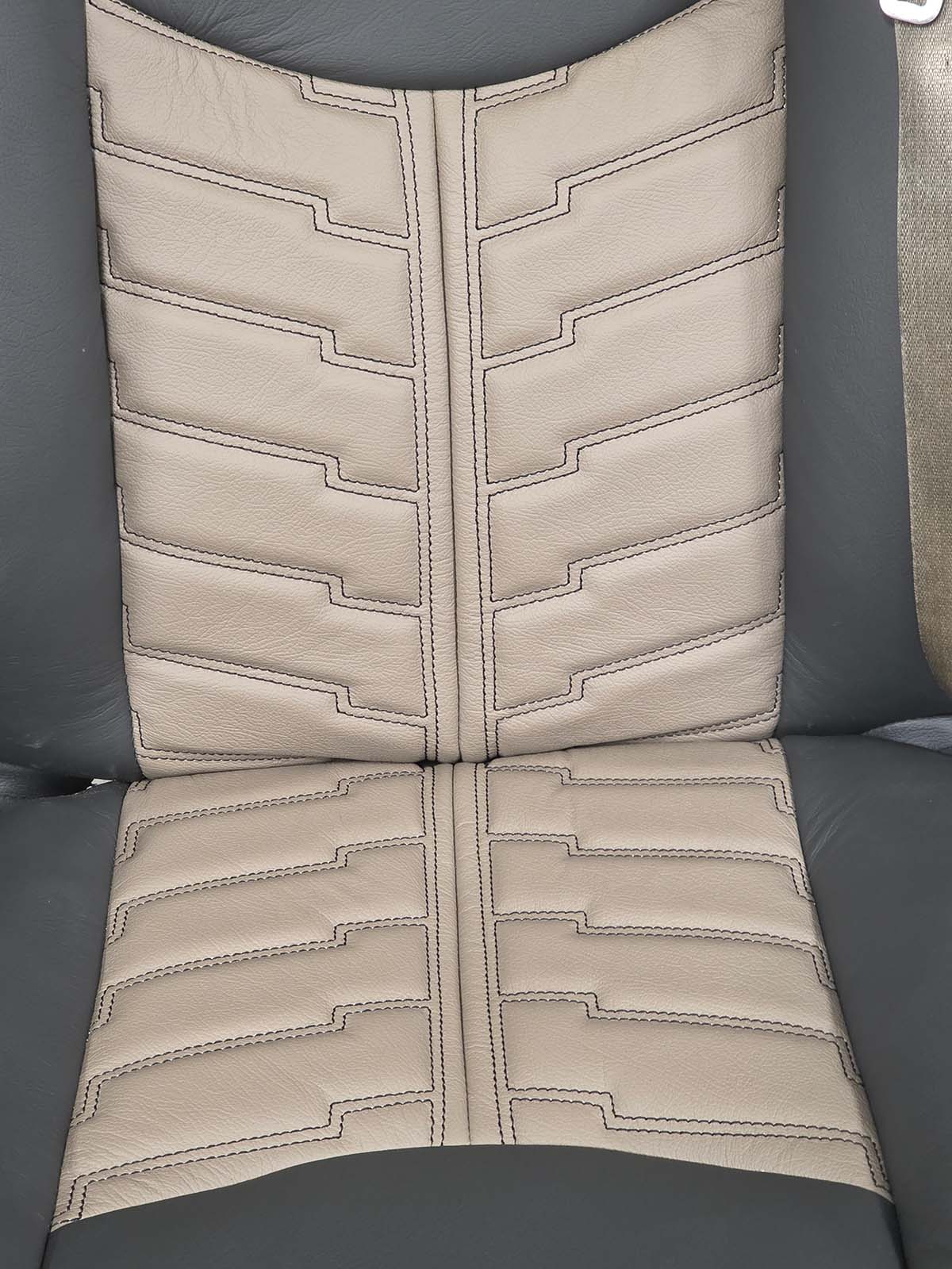 Close up of geometric diamond stitching on leather seat