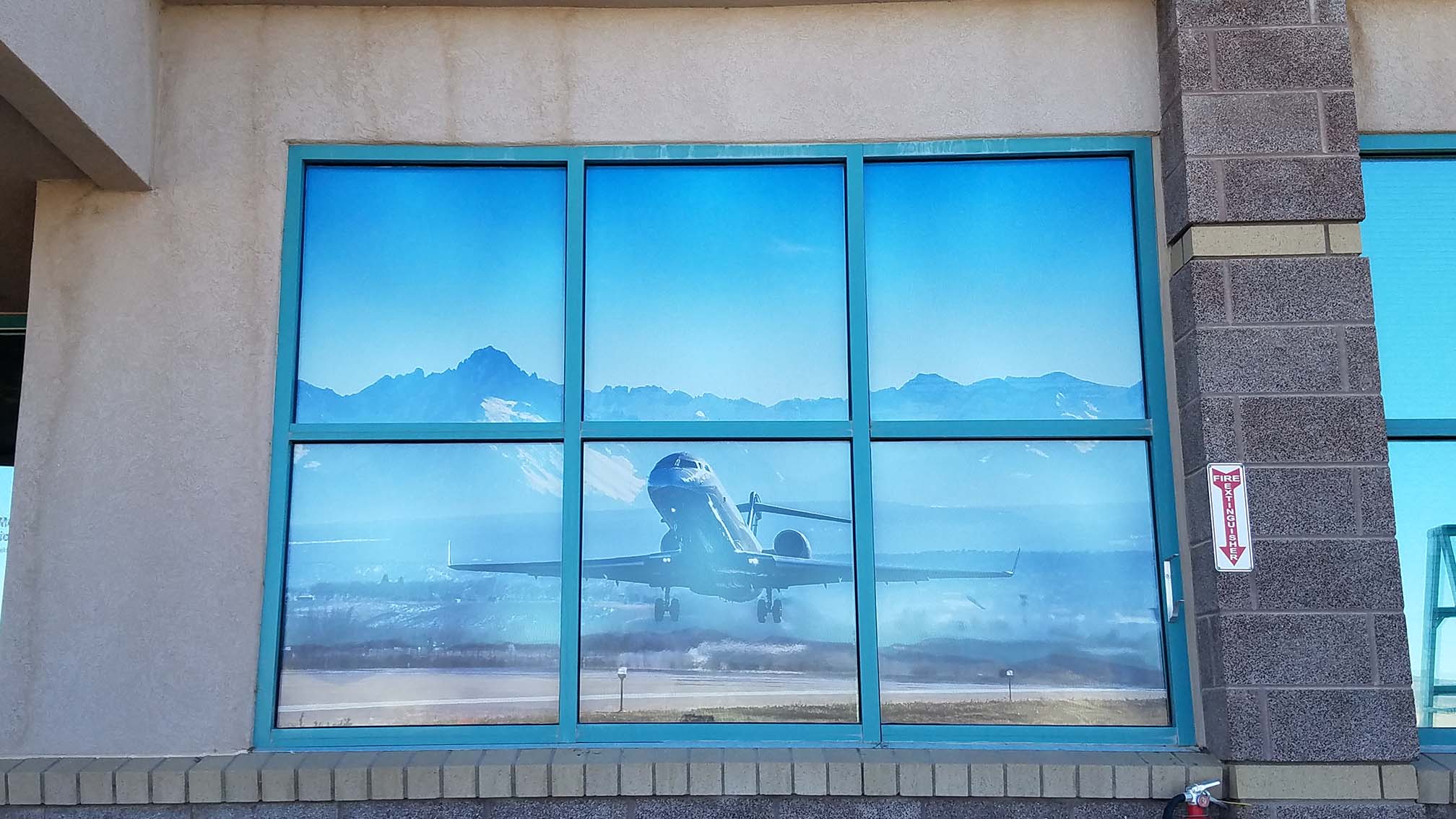 Commercial window film showcasing clear external aircraft reflection